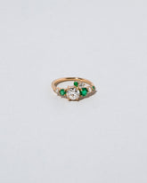  Luna Ring - White Diamond & Emerald on light color background.