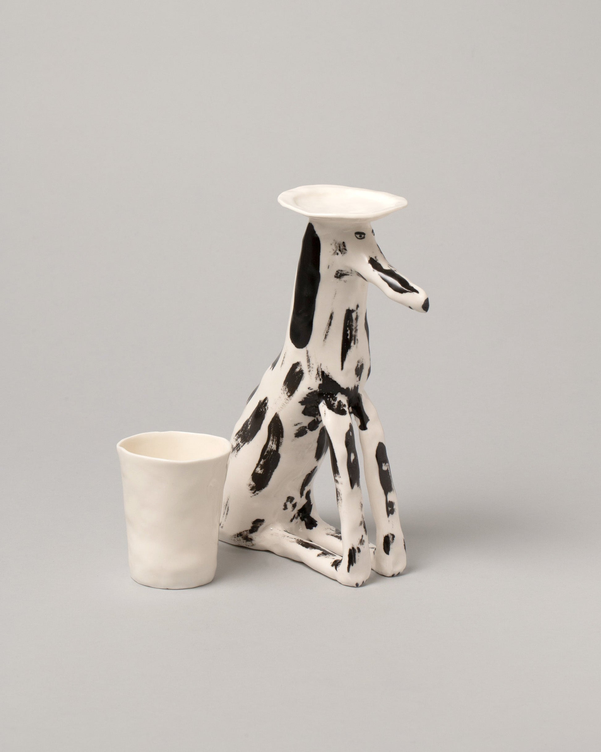Detail view of the Eleonor Boström Plant Pot Dogs on light color background.