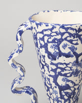 Detail view of Morgan Peck Blue and White Stretch Vase on light color background.