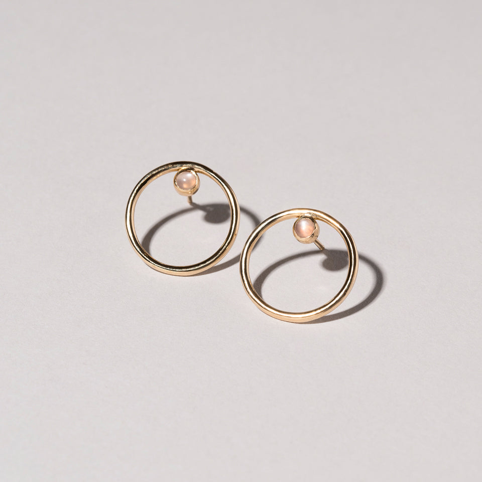 product_details:: Coil Stud Earrings on light color background.