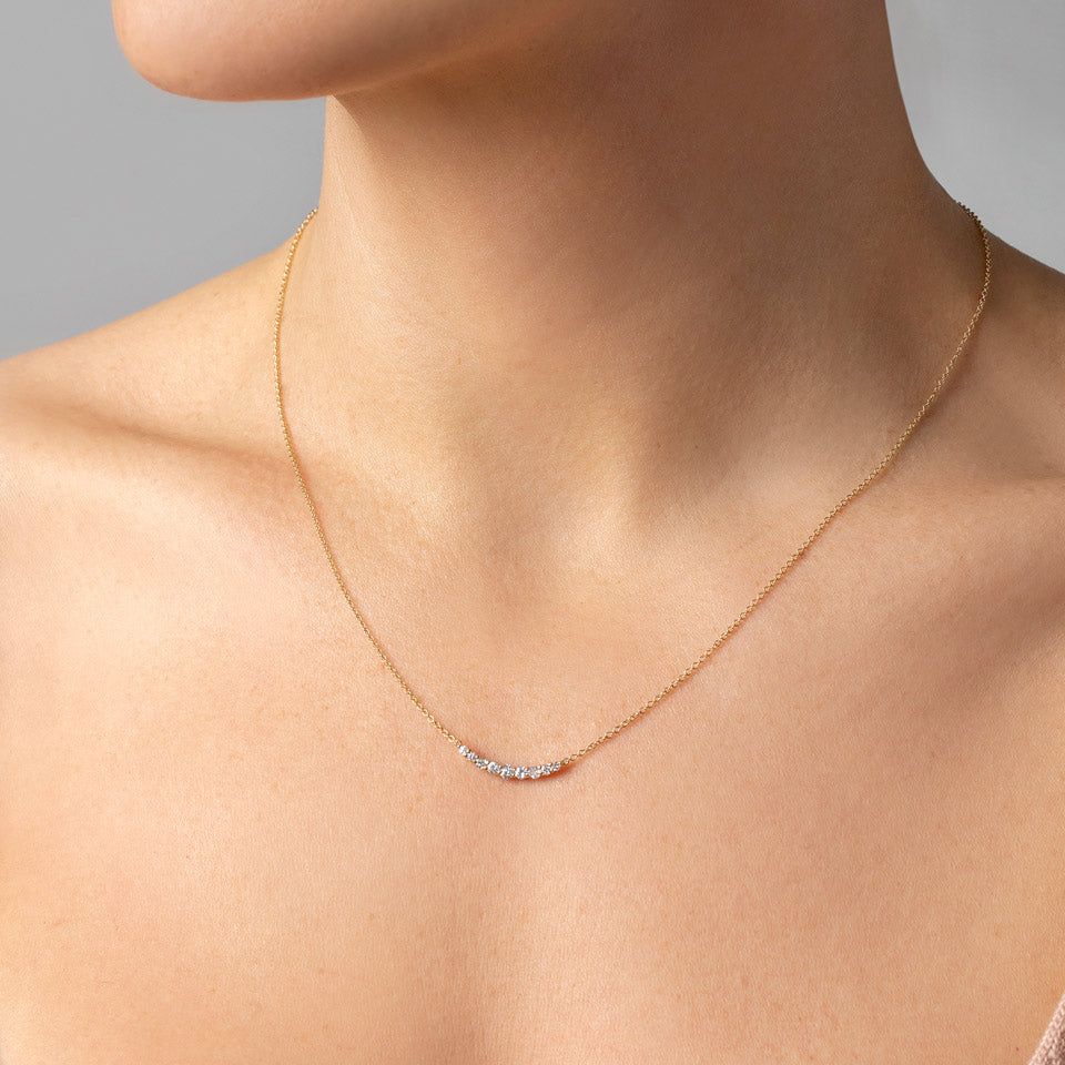 product_details::White Diamond Crescent Necklace on model.