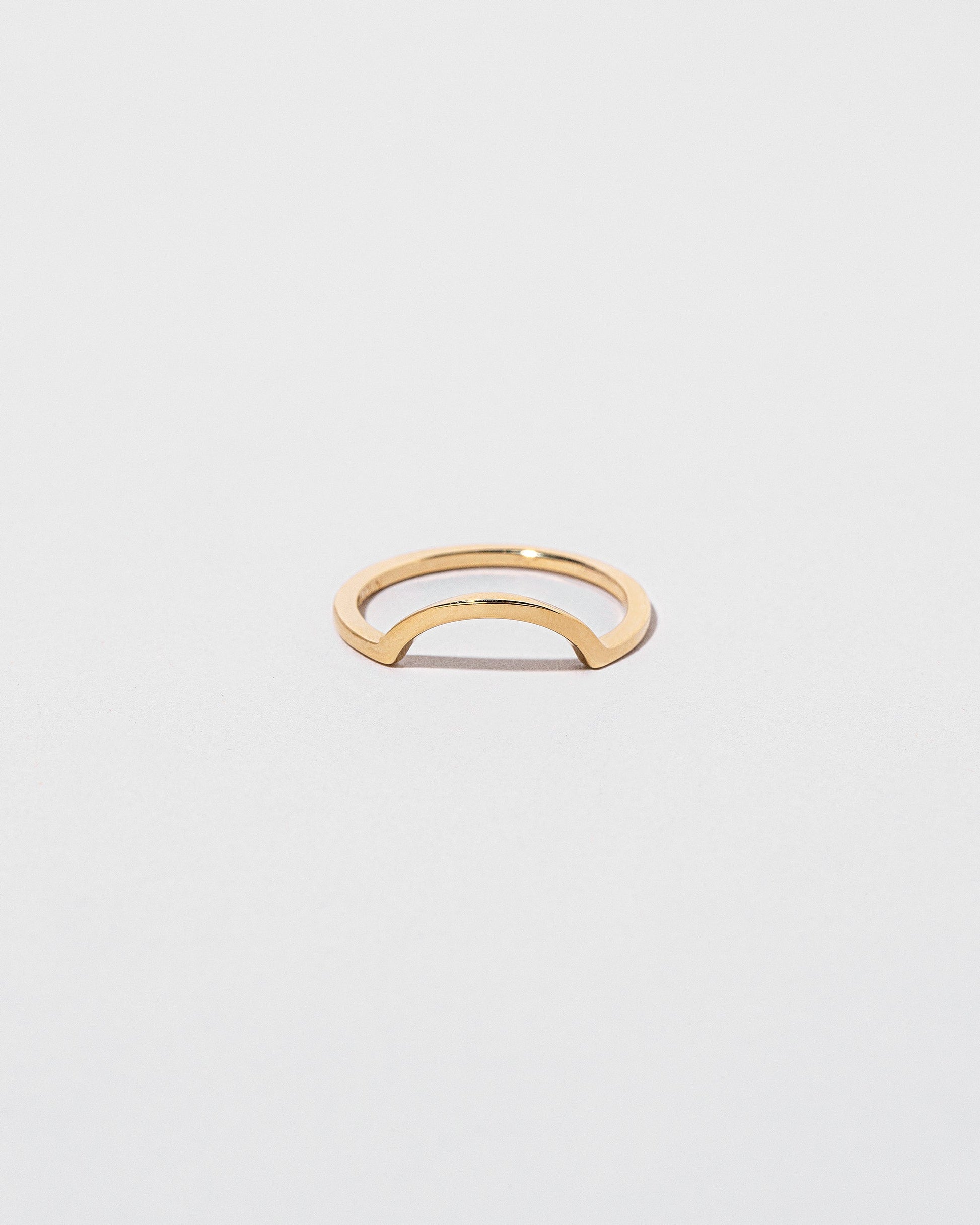 Gold Square Wire Curve Band on light color background.