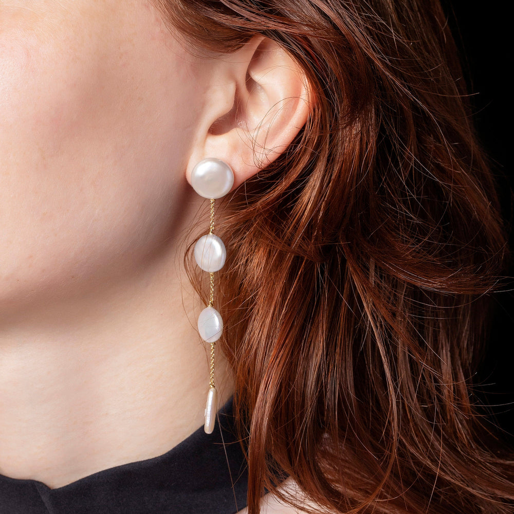 product_details::Antaeus Earrings on model.