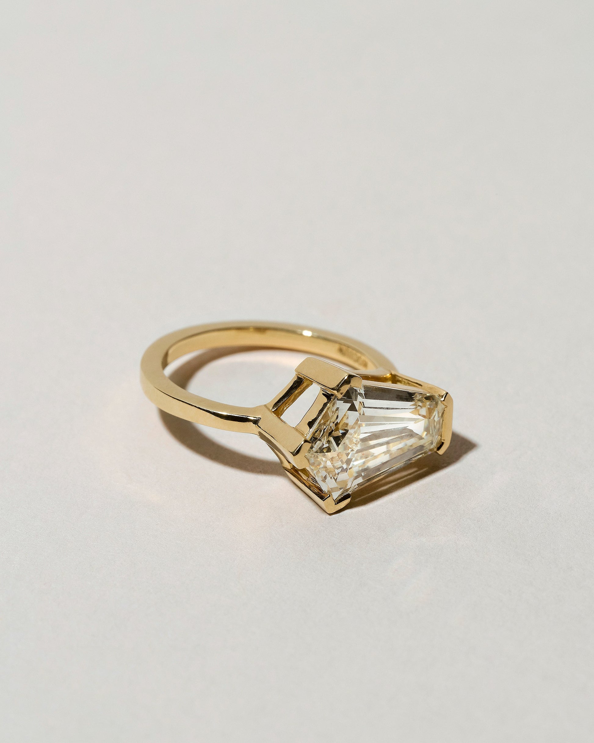  Modified Step Cut Diamond Ring on light color background.