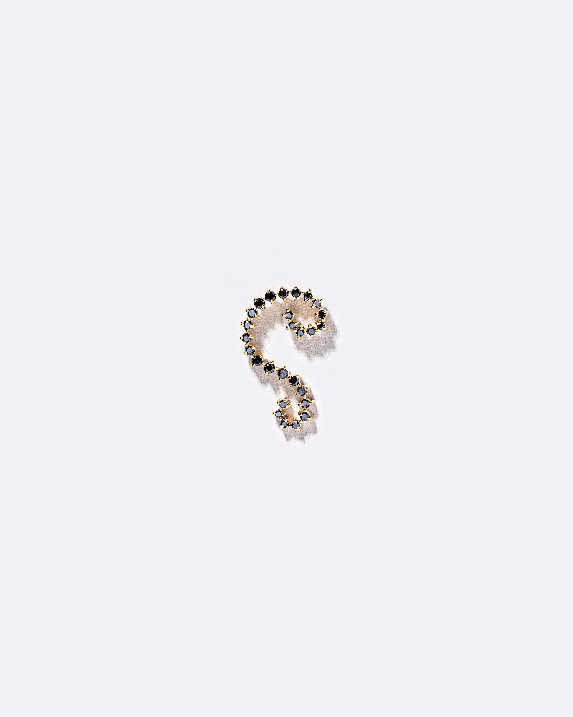 Right Black Diamond Symbol of Change Earring Single on light color background.