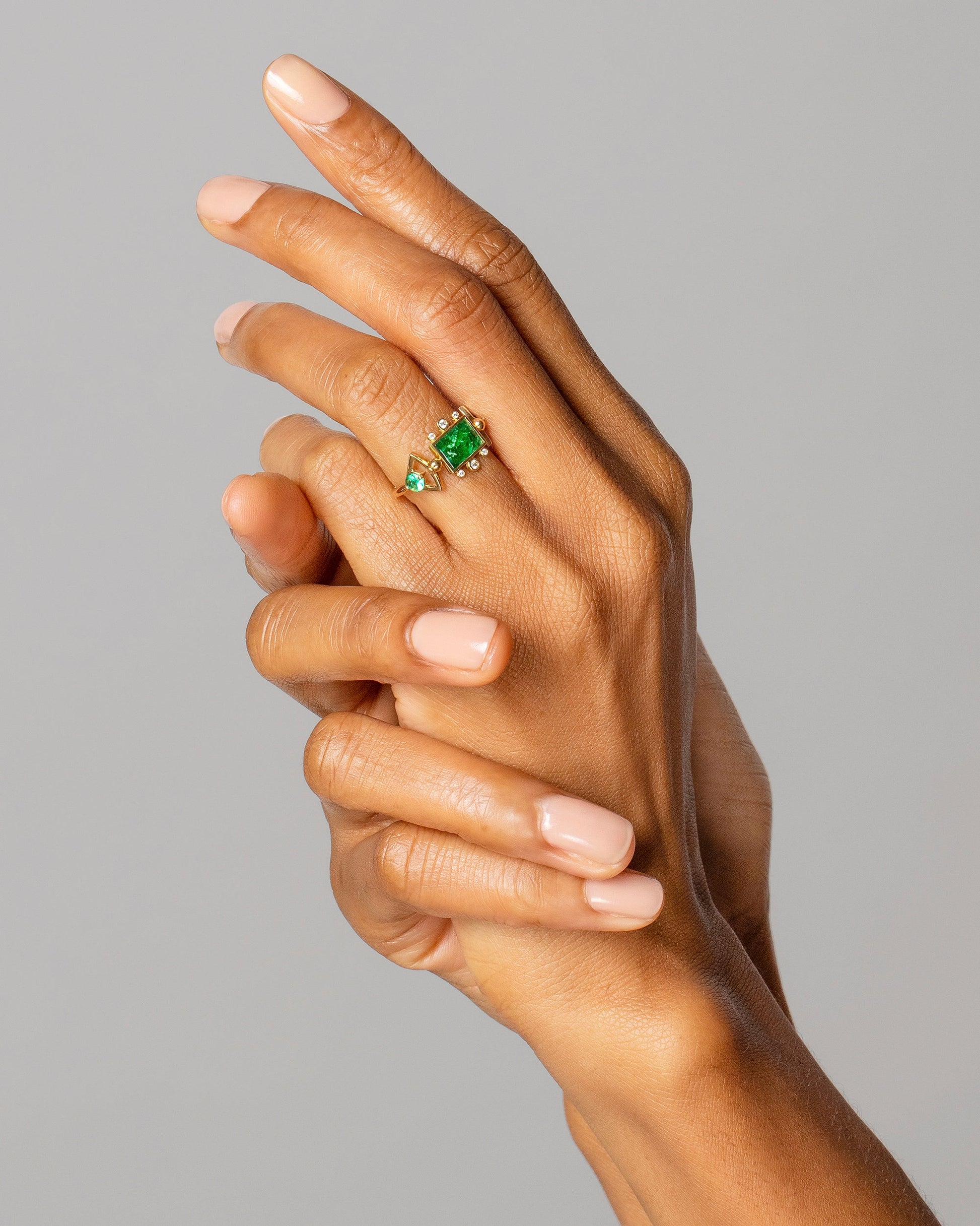 Emerald Lotus Ring on model.