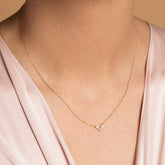 product_details::Gold Baguette Bar Necklace on model.