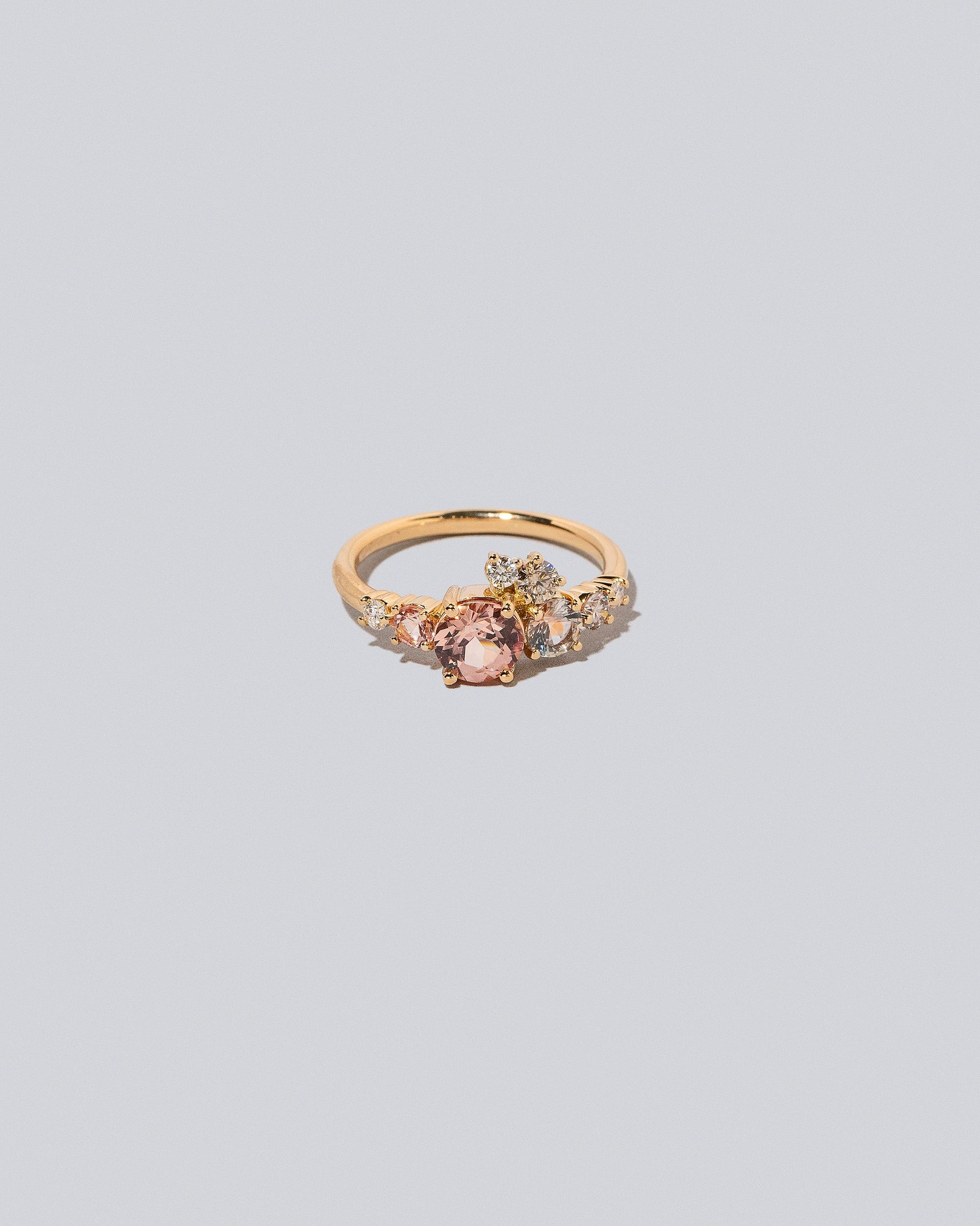 Lotus Garnet Luna Ring on light colored background.