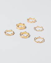 Gold Ripple Bands on light colored background.
