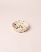 La Ceramica Vincenzo Del Monaco Colored Drops Cereal Bowl on light color background.