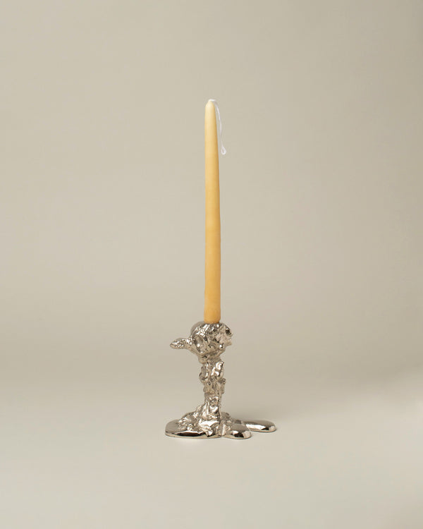 POLSPOTTEN Silver Small Drip Candle Holder on light color background.