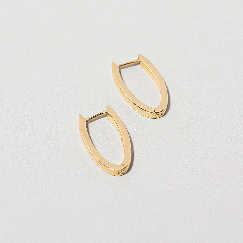 product_details::Tiny Loop Hoops on light color background.