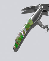 Detail view of Santa Fe Stoneworks Green Turquoise Waiter's Knife on light color background. 