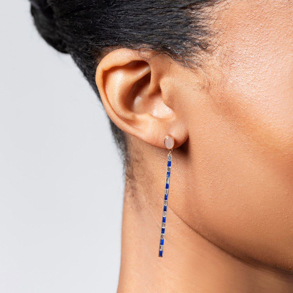 product_details::Peach Moonstone Transformation Earrings on model.