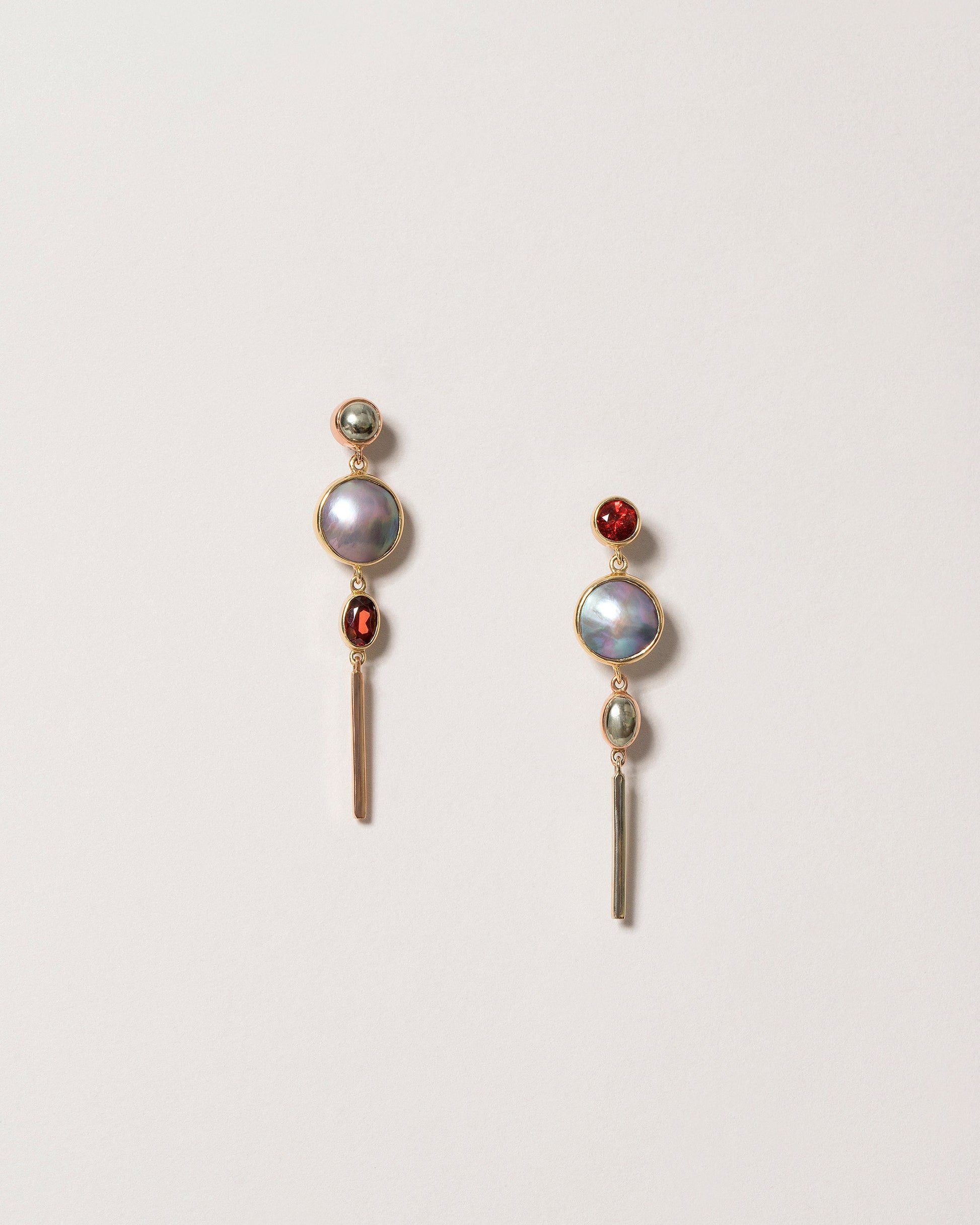 Act 2. Earrings 3 on light color background.