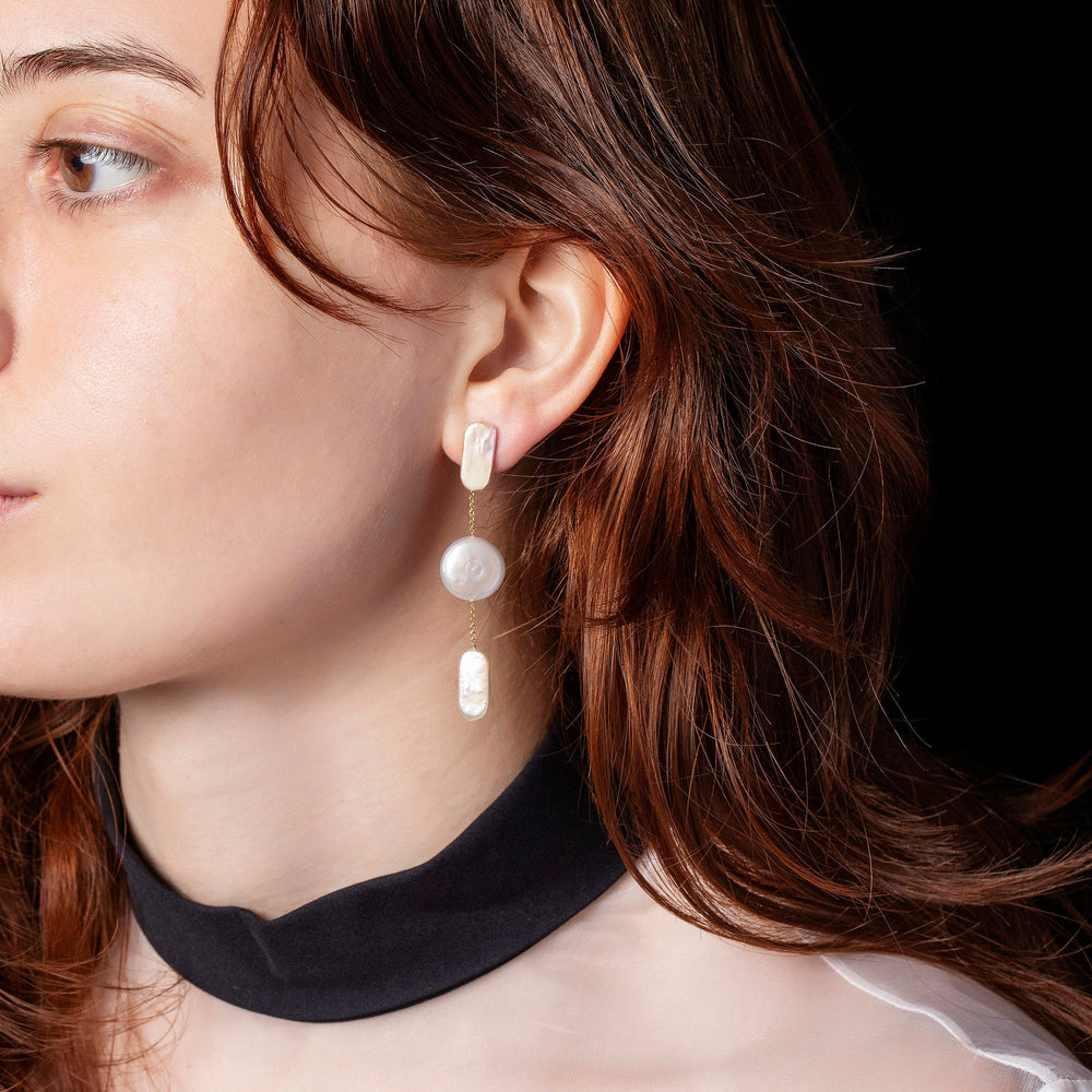 product_details::Theseus Earrings on model.