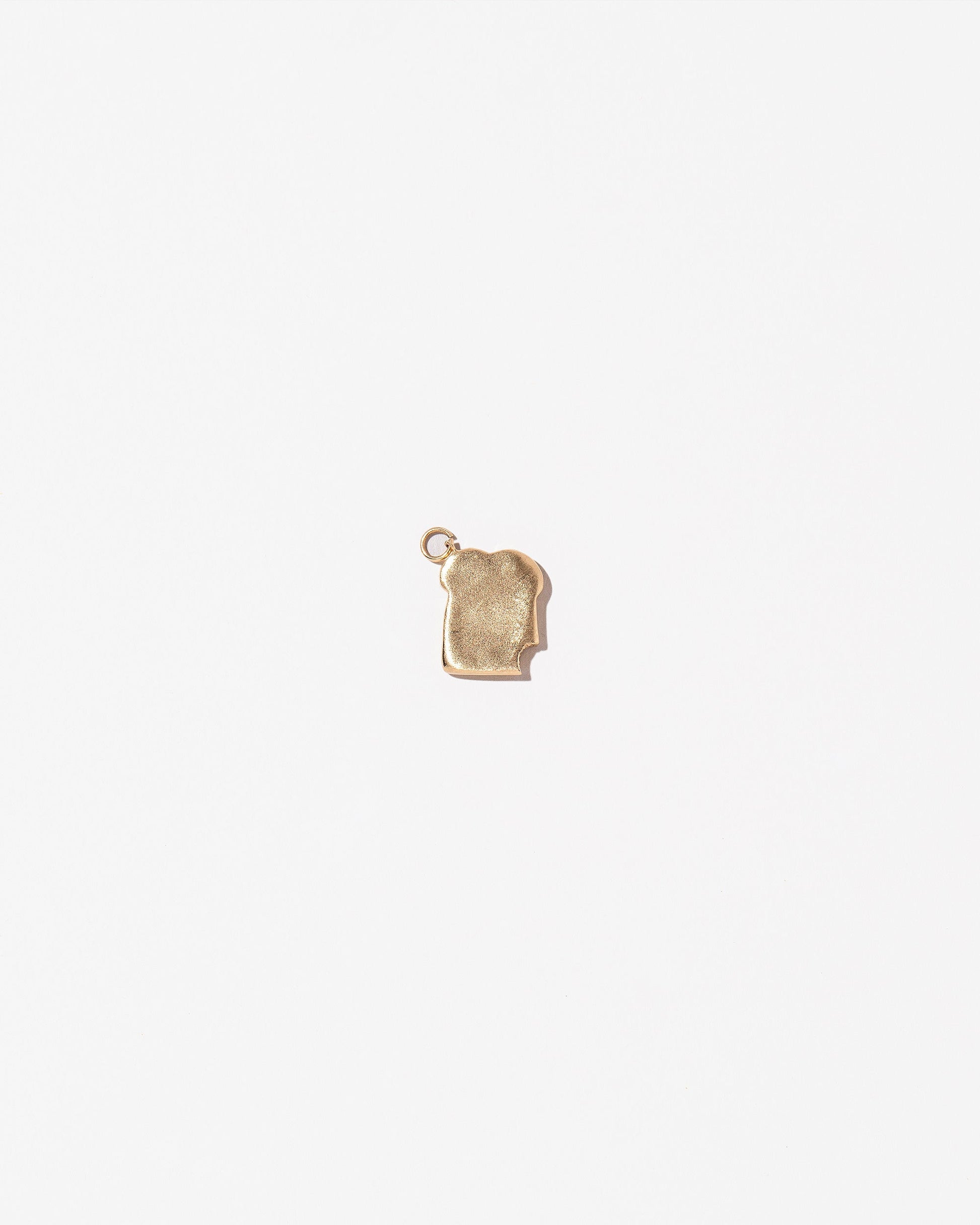  Toast Charm - with a Bite on light color background.