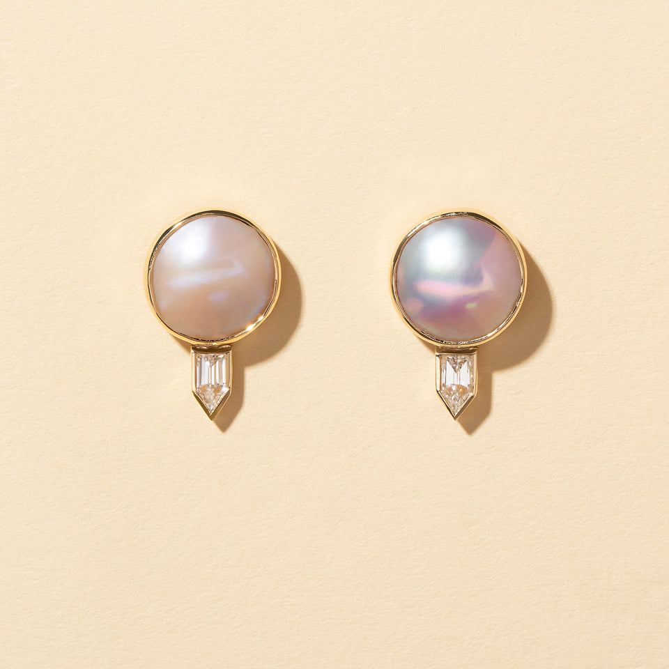 product_details:: Mabe Pearl & Diamond Earrings on light color background.