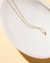  Triangle Necklace on light color background.