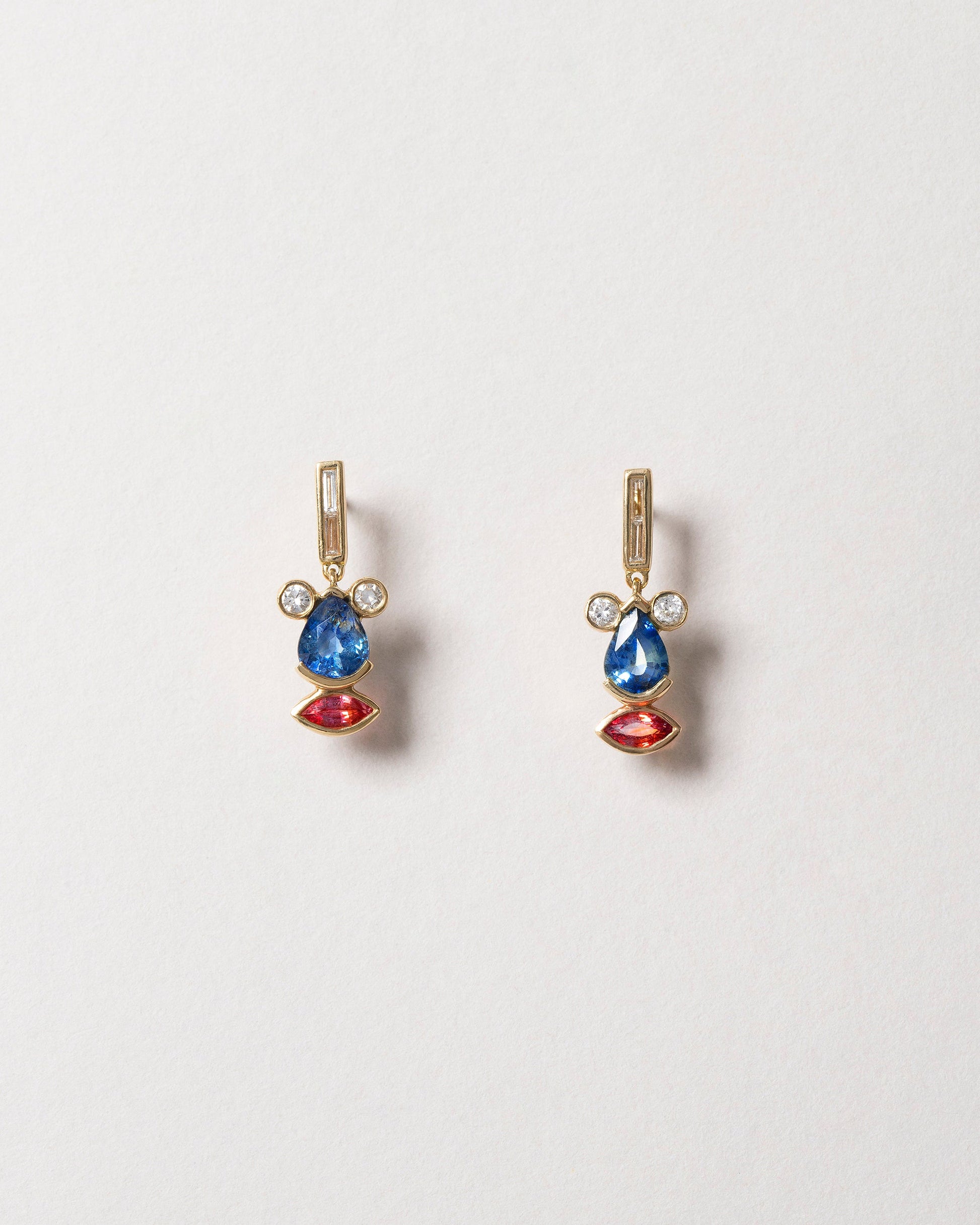  Sapphire & Diamond Creature Earrings on light color background.