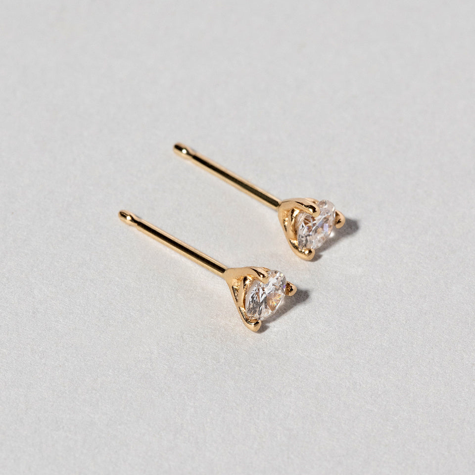 product_details:: Martini Studs - White Diamond on light color background.