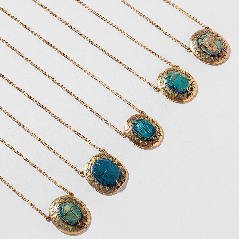 product_details:: Scarab Necklace on light color background.