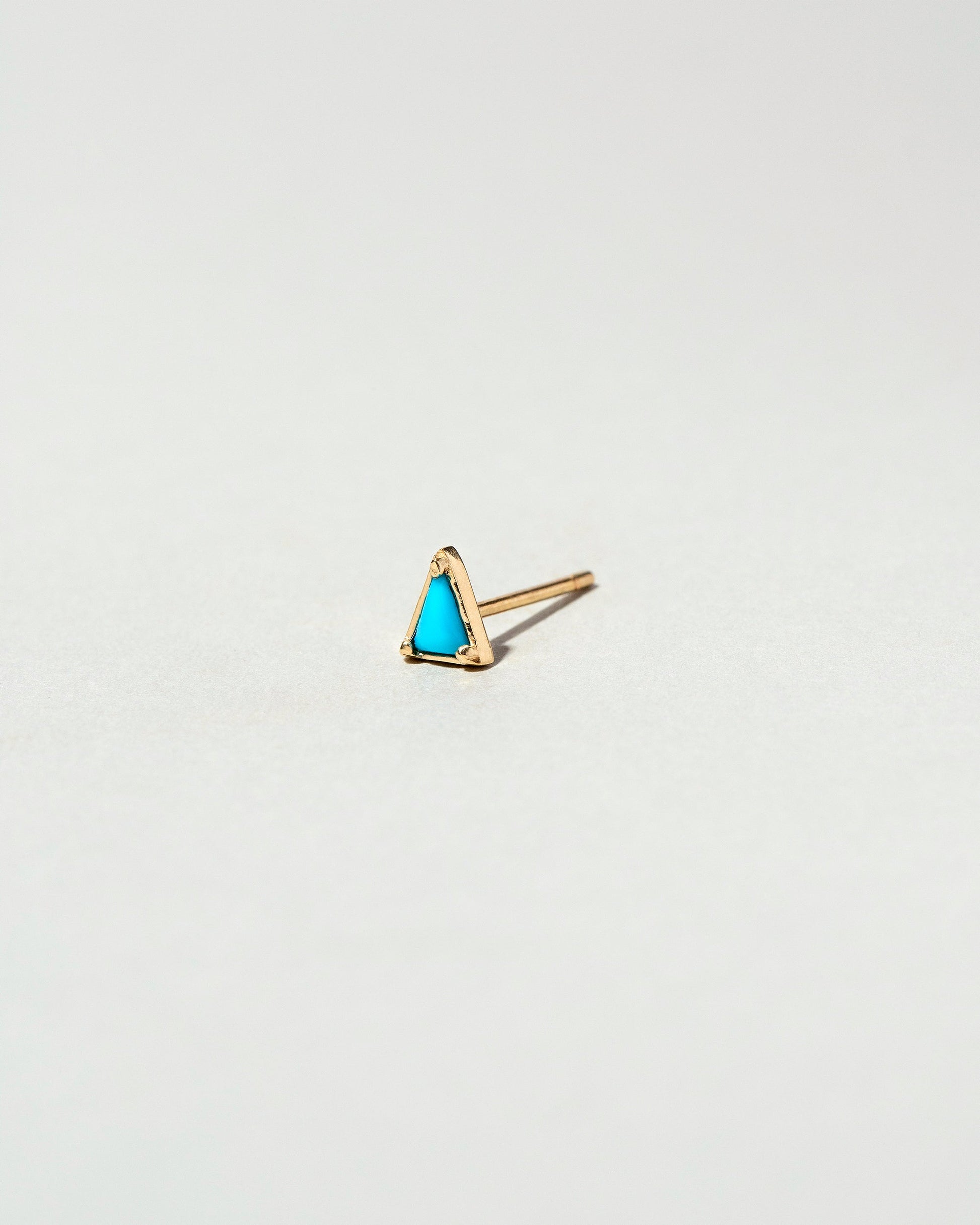  Triangle Single Stud on light color background.