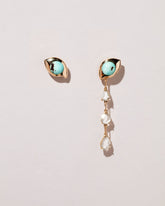  Turquoise Transformation Earrings on light color background.