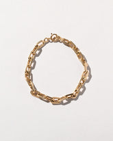  Faceted Cable Chain Bracelet on light color background.