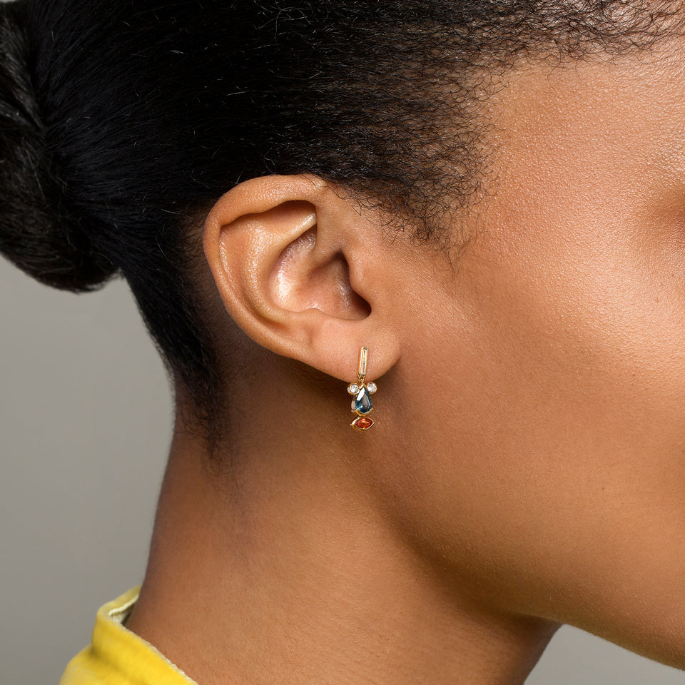 product_details::Sapphire & Diamond Creature Earrings on model.