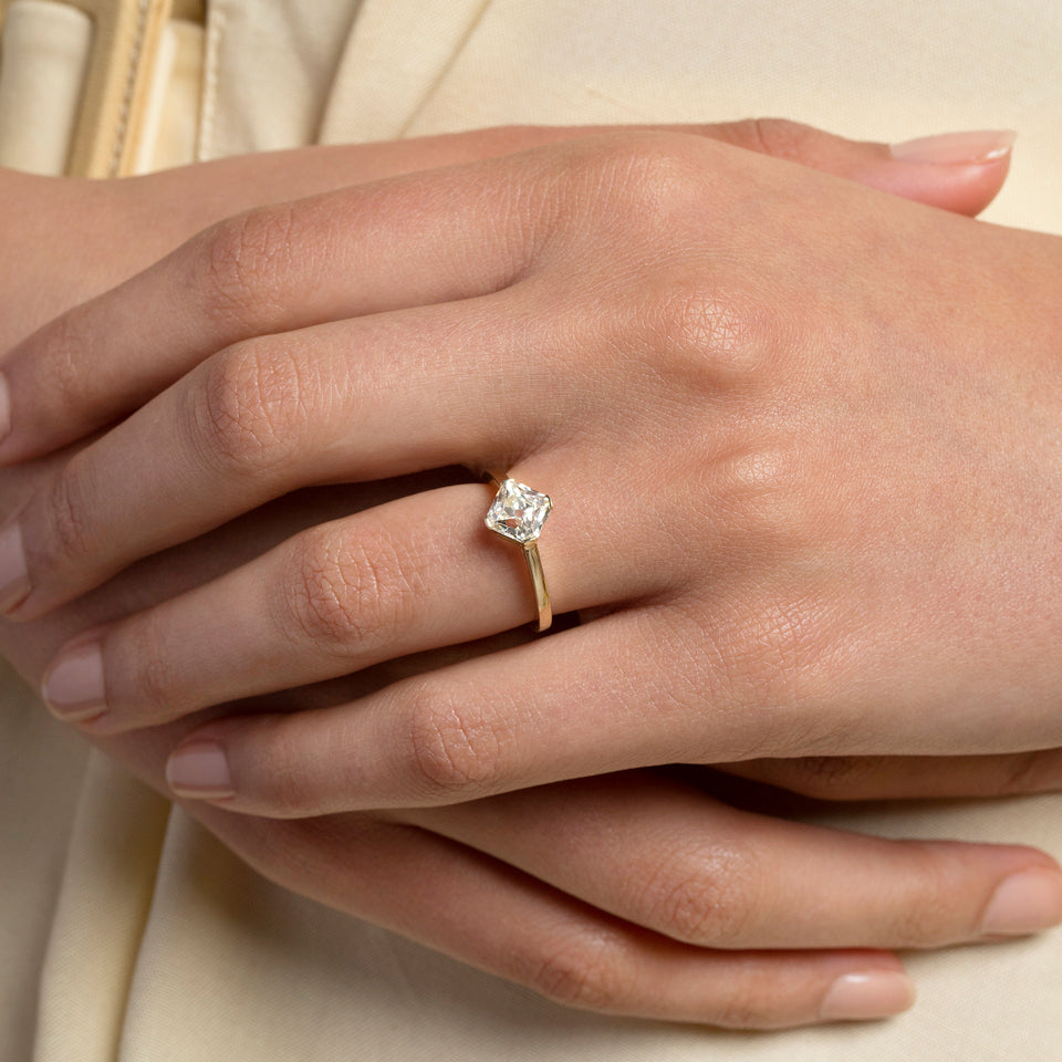 product_details::Cushion Modified Brilliant Diamond Solitaire Ring on model.