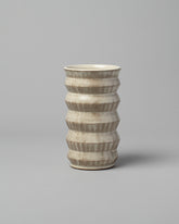 Jeremy Ayers Combed Accordion Vase on light color background.