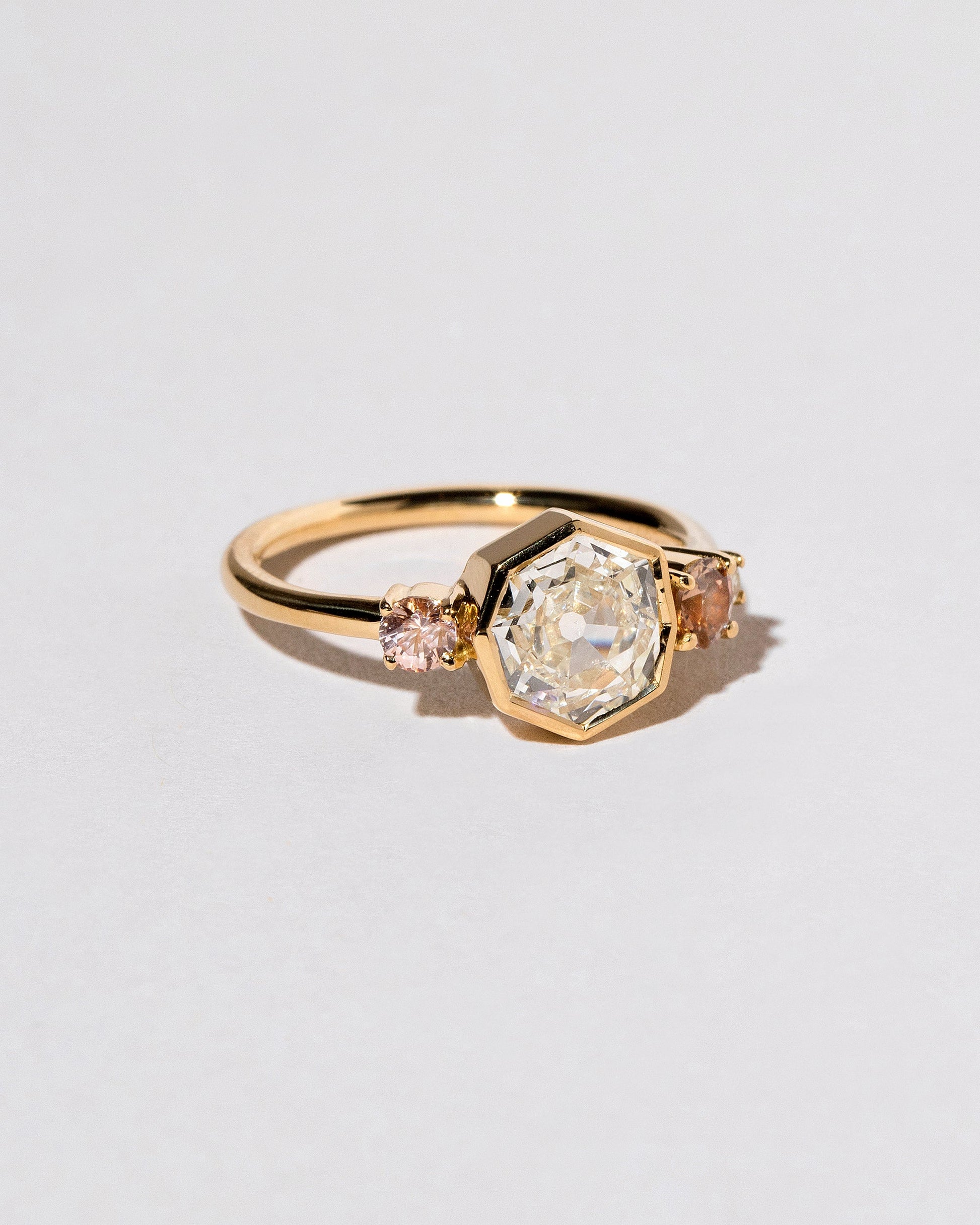  Theia Ring on light color background.