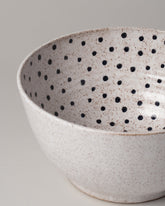  Detail view of Recreation Center Dot Serving Bowl on light color background.