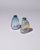 Group of BaleFire Glass Small Miracle Blue Suspension Vases on light color background.