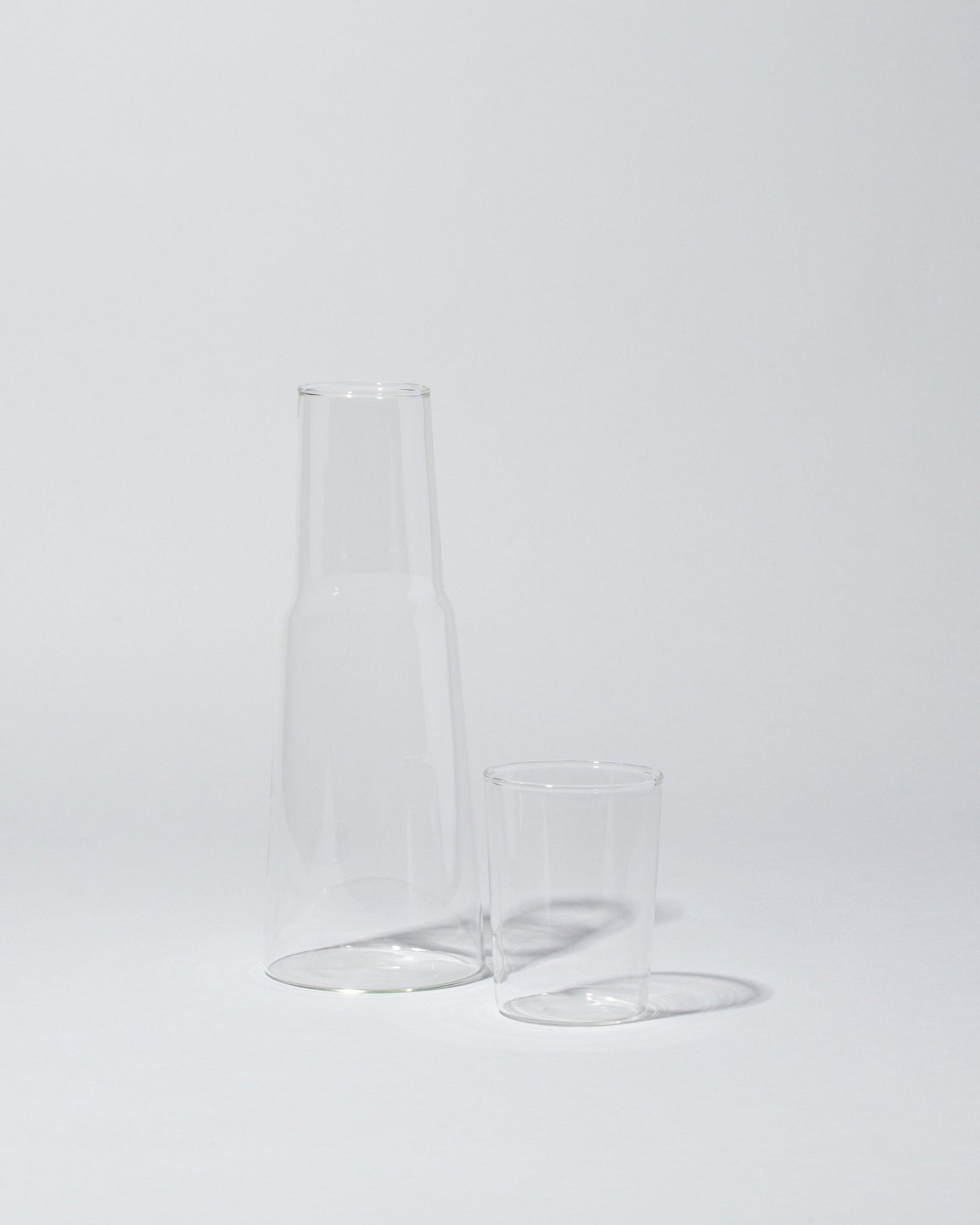 Detail view of the Ichendorf Milano Torre Night Bottle & Glass on light color background.