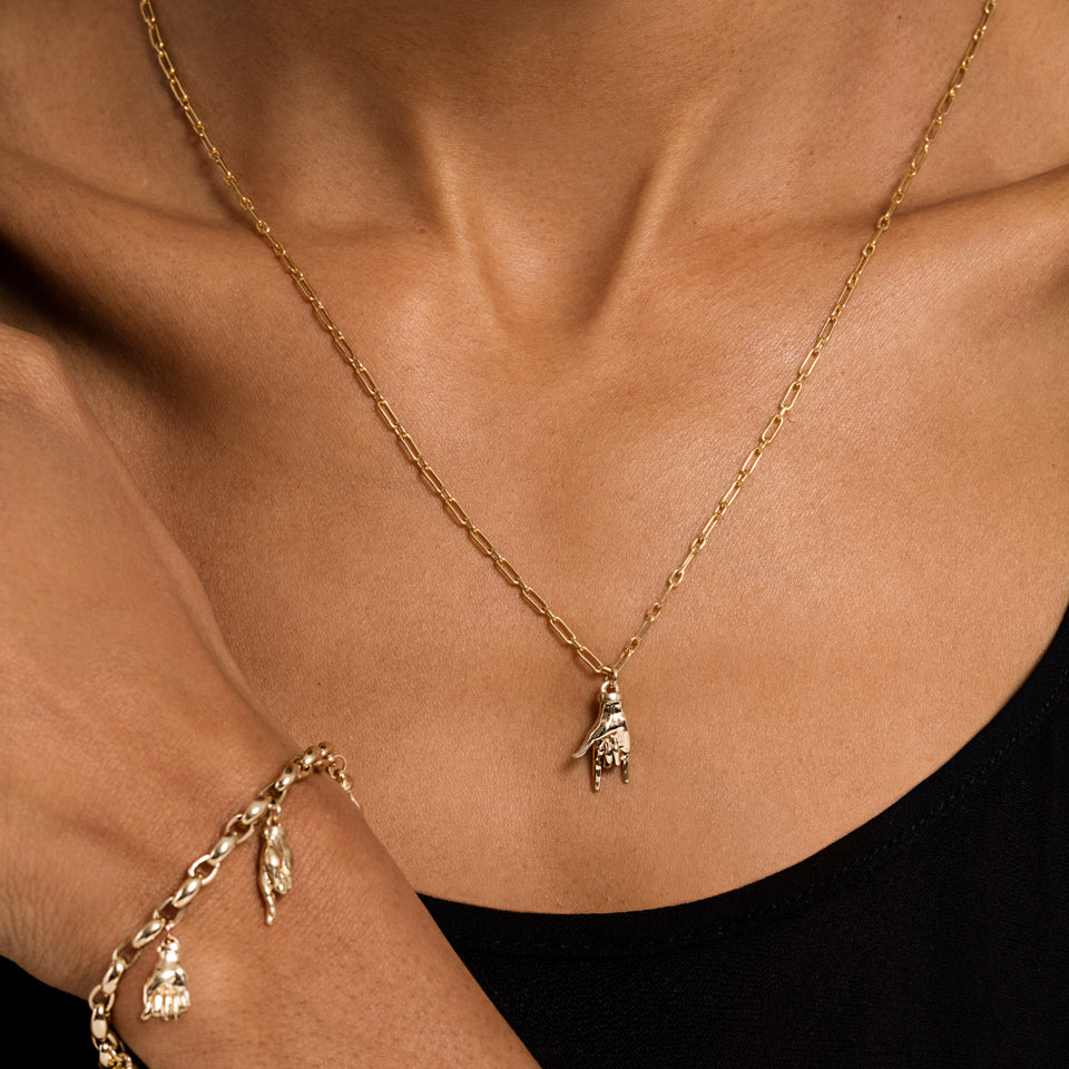 product_details::Sign Language Charm on model.