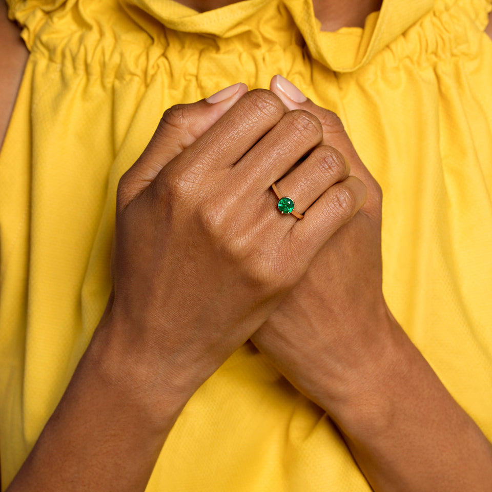 product_details::Sun & Moon Ring - Emerald on model.