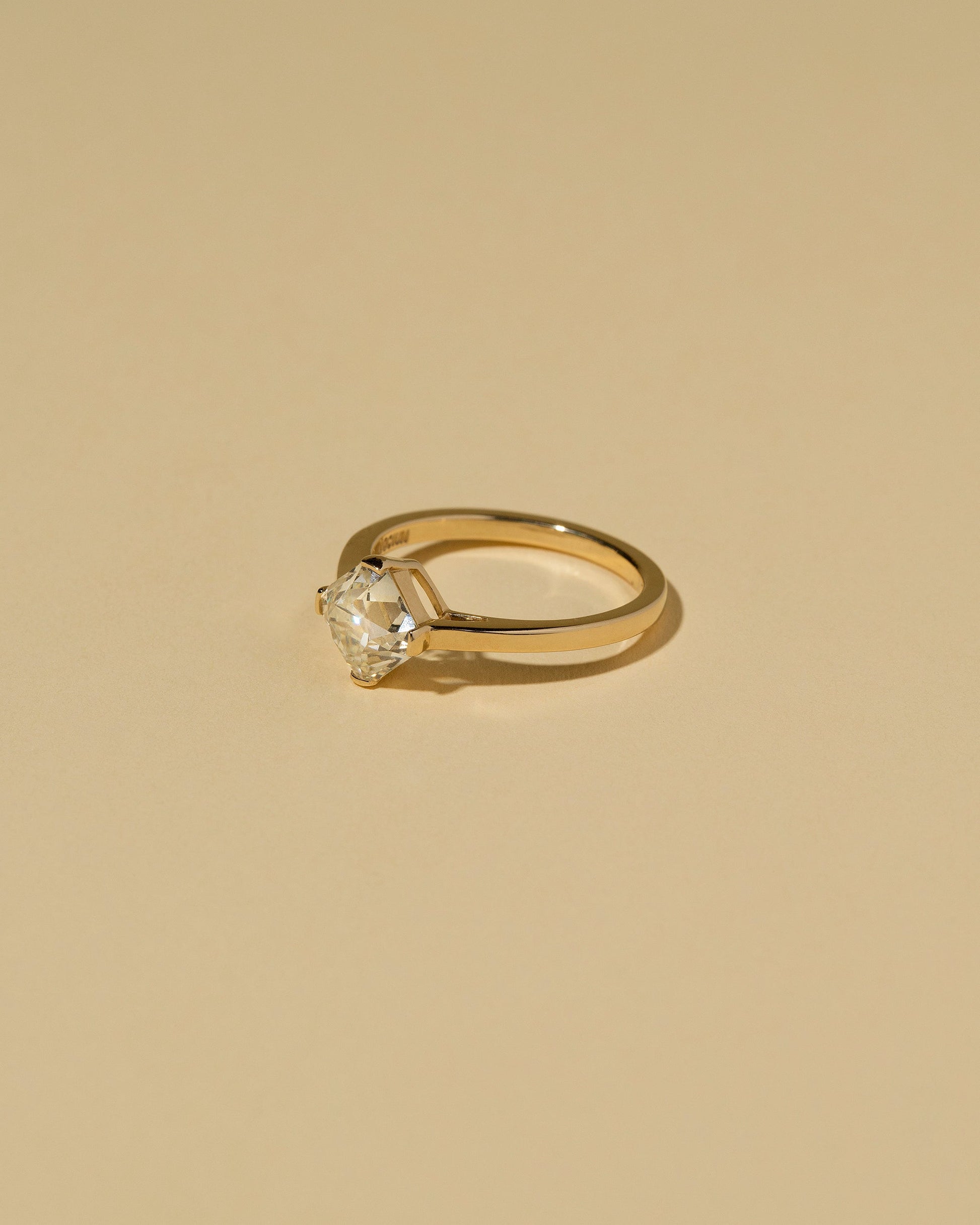  Cushion Modified Brilliant Diamond Solitaire Ring on light color background.