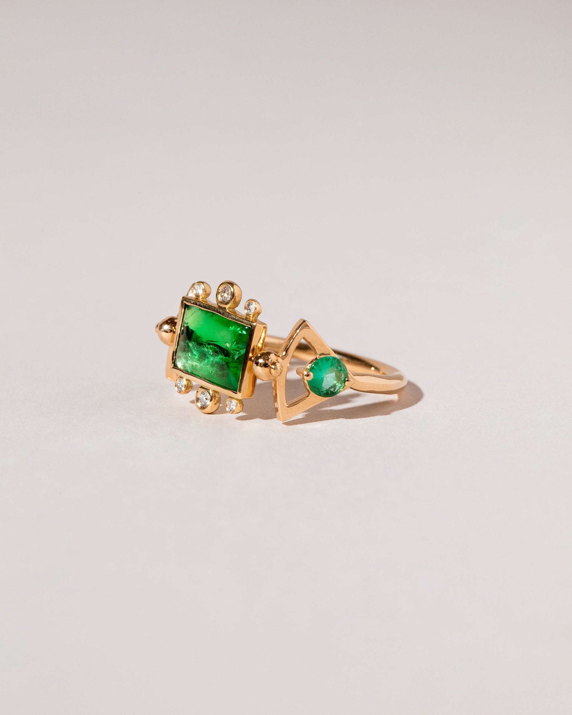  Emerald Lotus Ring on light color background.