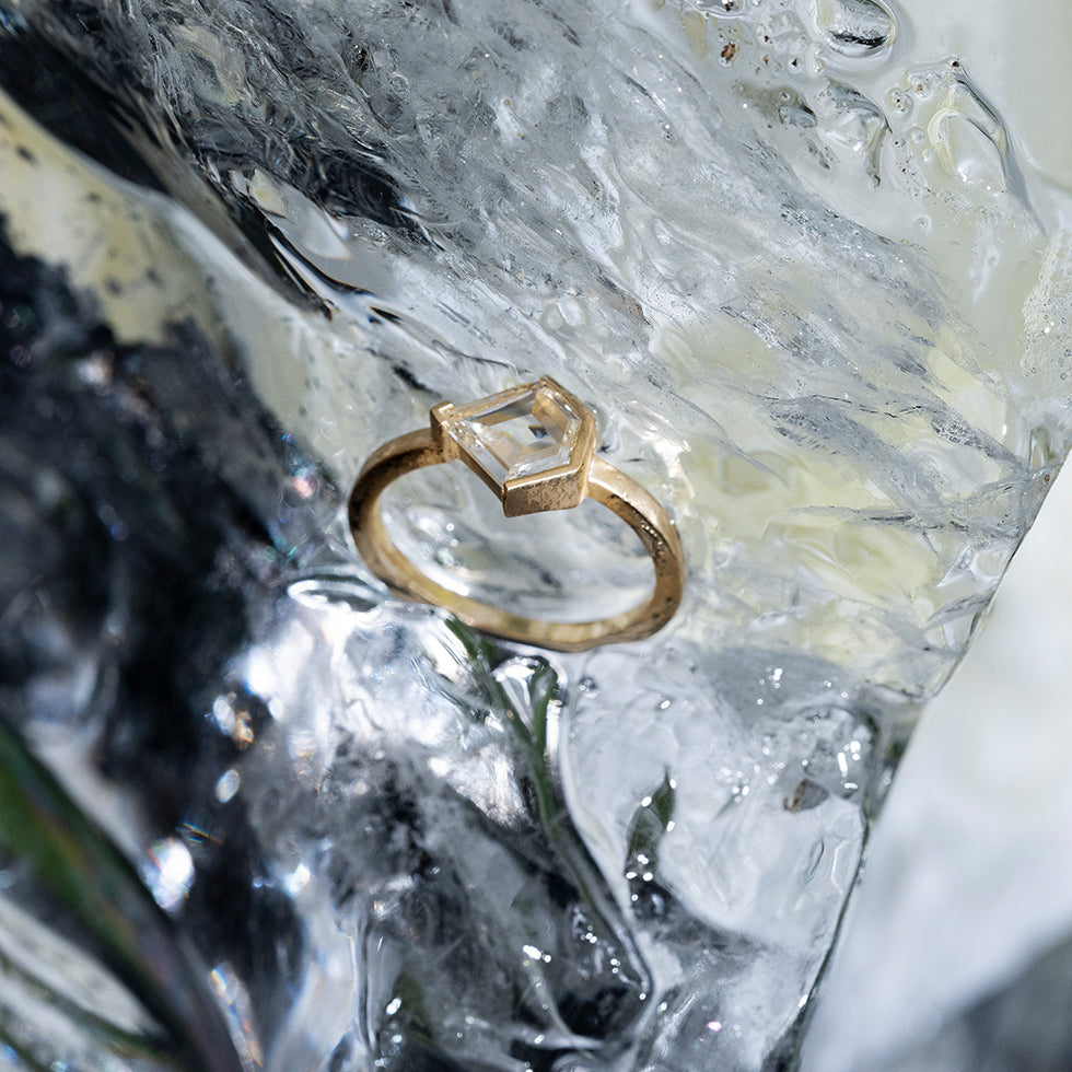 product_details::Styled photo featuring solitaire style ring.