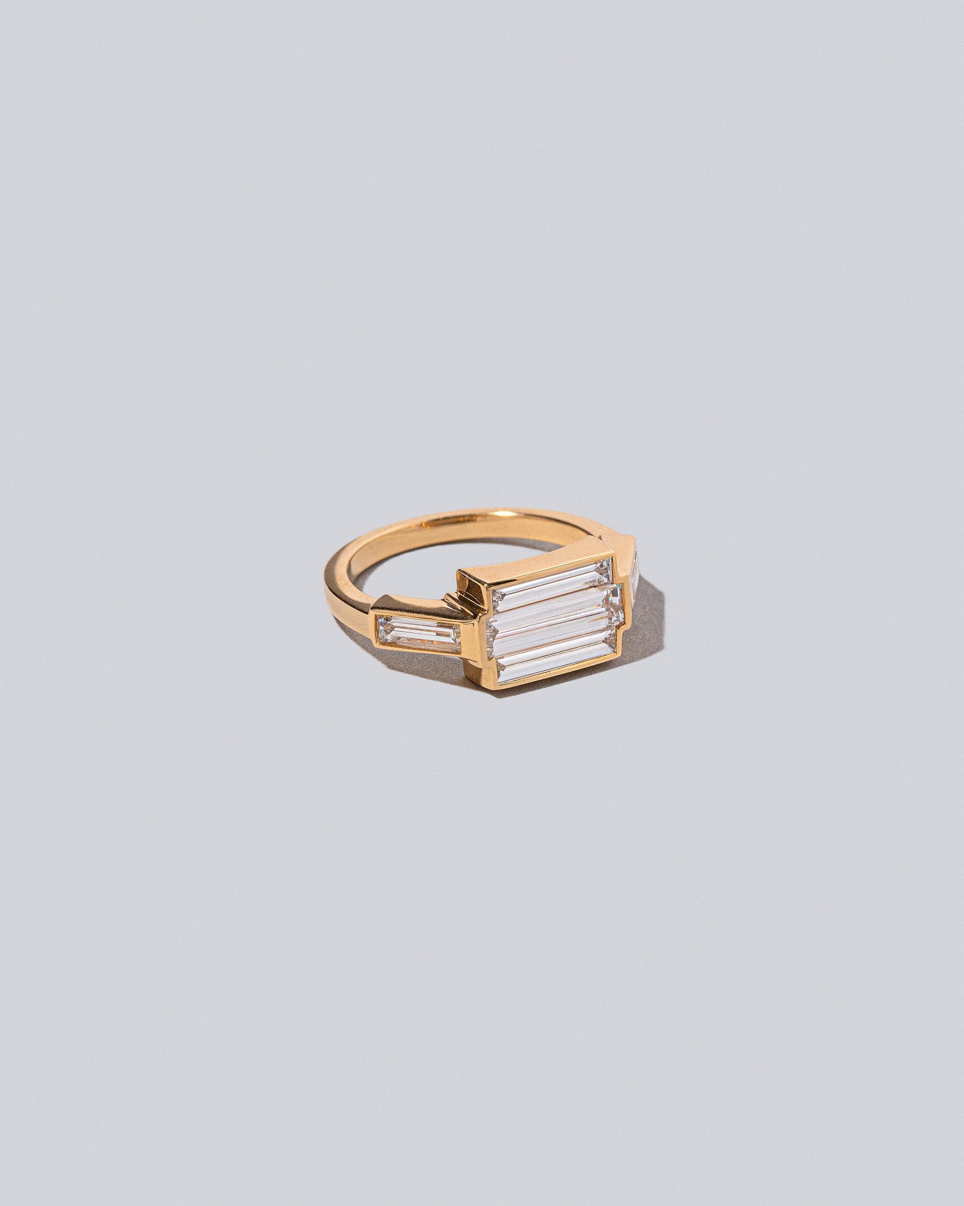 Product photo of the Haiku Ring on light light color background.