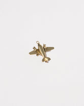  Airplane Charm on light color background.