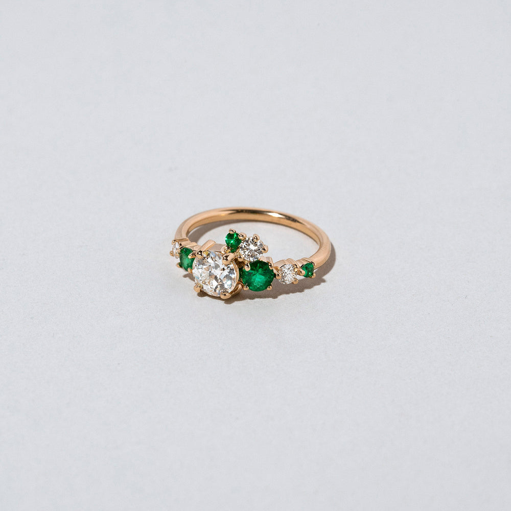 product_details:: Luna Ring - White Diamond & Emerald on light color background.