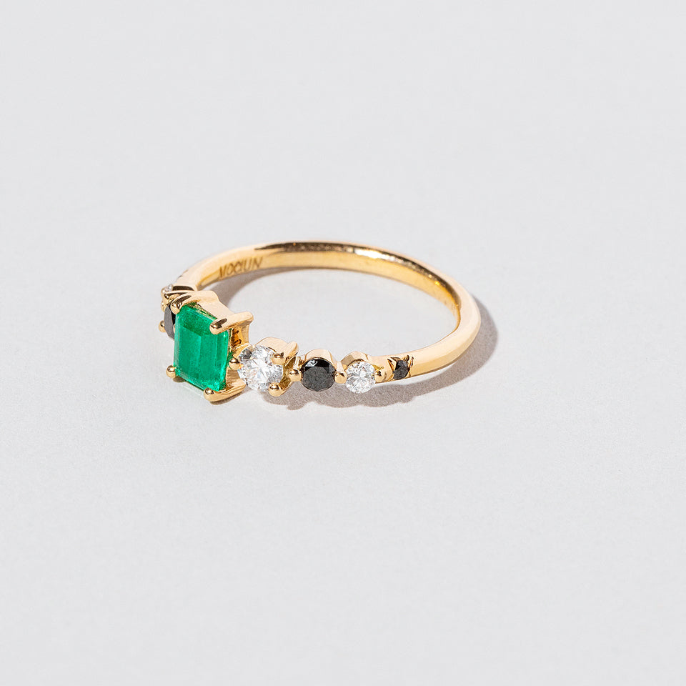 product_details:: Seven Sisters Ring - Emerald on light color background.
