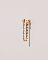 Golden Twist Stud Earring Single on light color background.