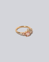 Lotus Garnet Luna Ring on light colored background.