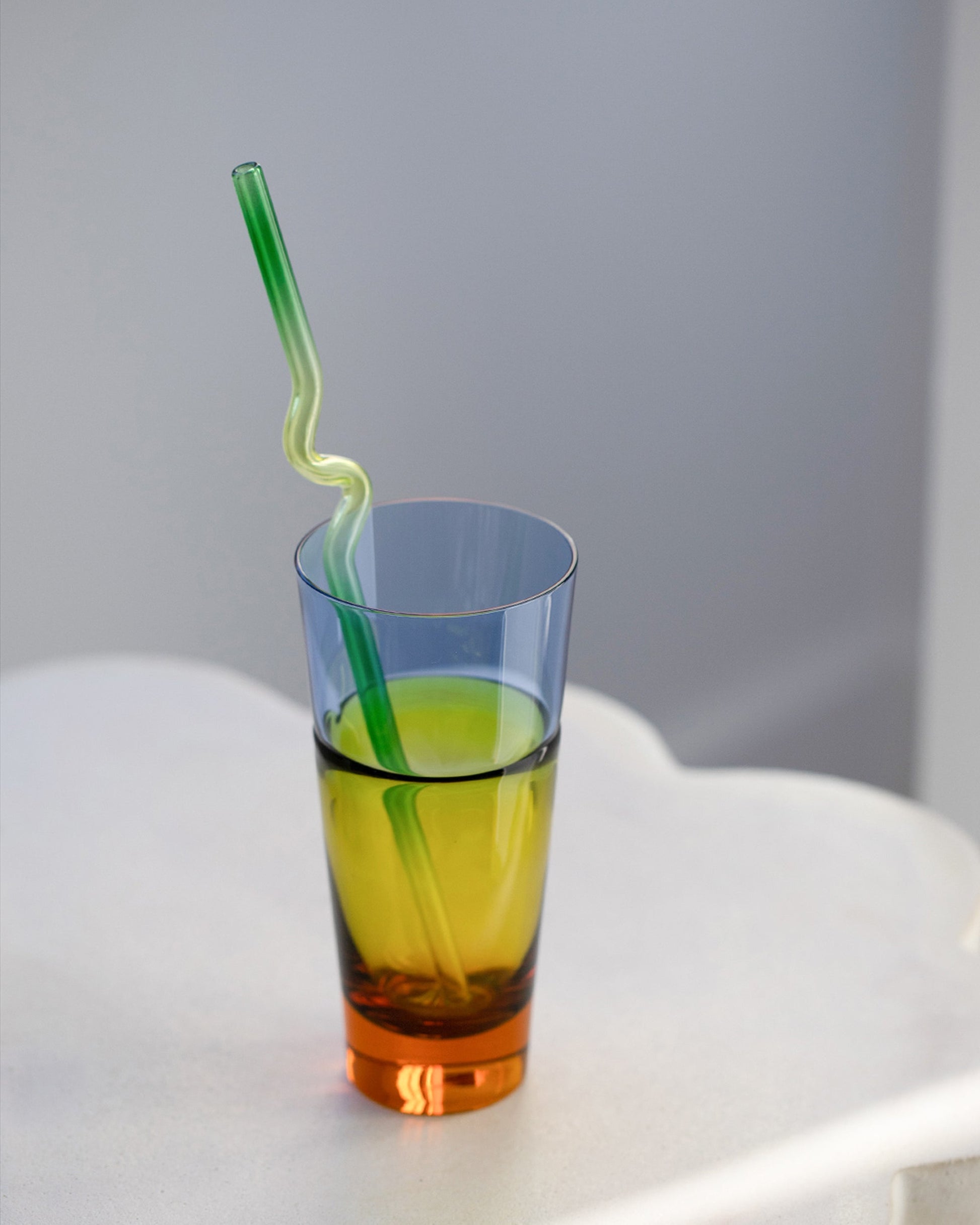 Styled image featuring Misha Kahn Yellow and Green Suck It Up Glass Straw and Sugahara Duo Tumbler.