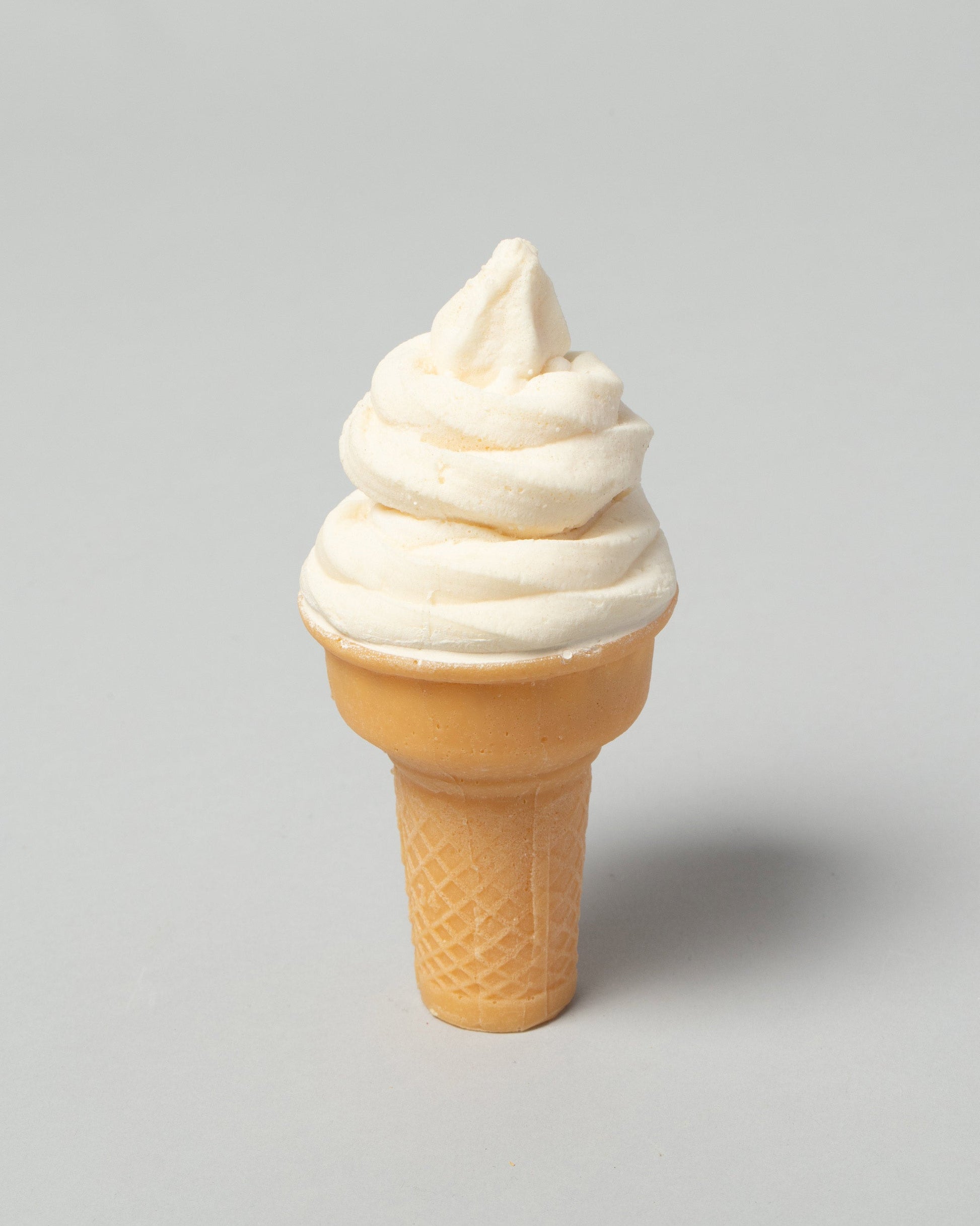 Closeup detail of the Spills Vanilla Cone Ice Cream on light color background.