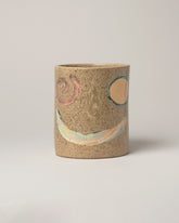 E.E. Ceramics Smiley Utensil Holder on light color background.